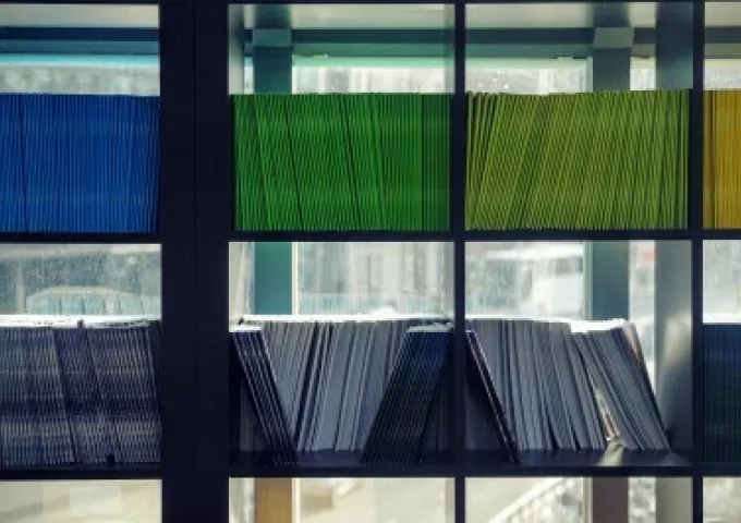 shelves of documents in primary colors